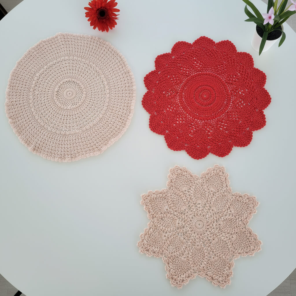 A_top_down_view_of_a_realistic_lifestyle_image_featuring_crochet_doilies__doily_1____doily_2___and.jpg